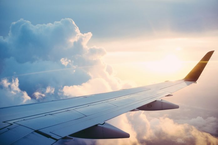 Airplane wing in the sky