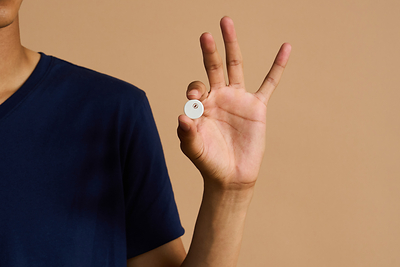 The shoulder of a man holding a new diabetes health care product