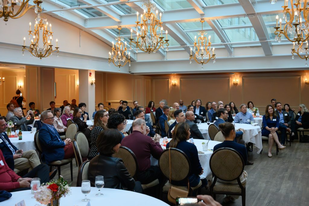 A group of people in a kitchen event space
