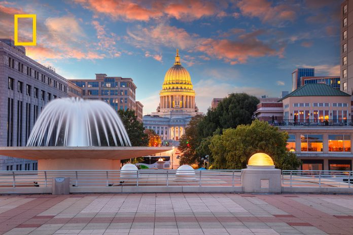 A fountain and Wisconsin's capitol building